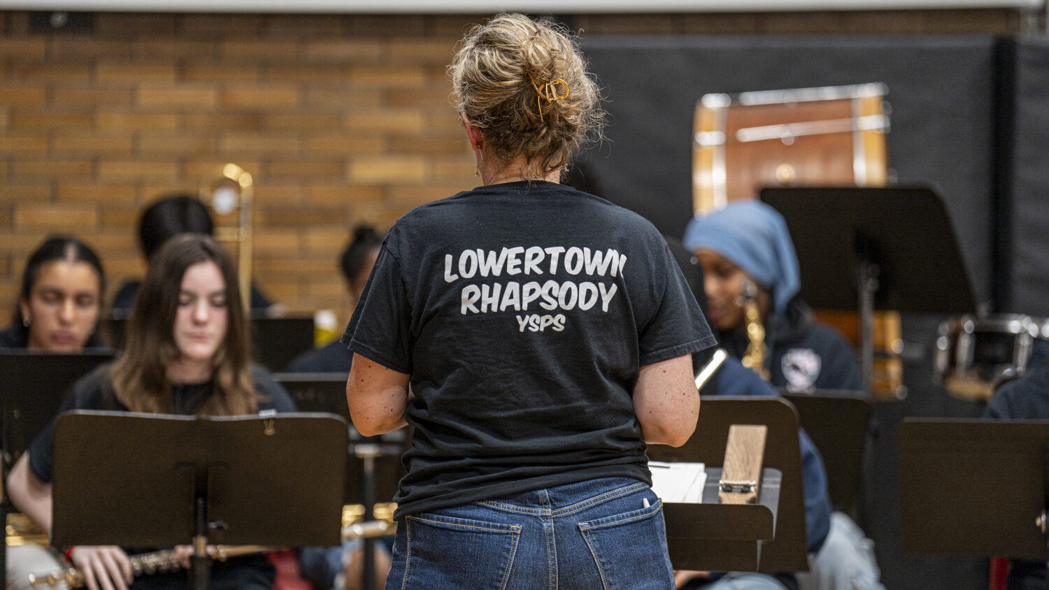 A staffmember's t-shirt reads "Lowertown Rhapsody".