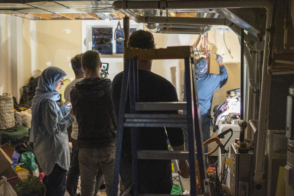 Work being carried out and documented at the Multifaith Housing Initiative community at Carver Place.